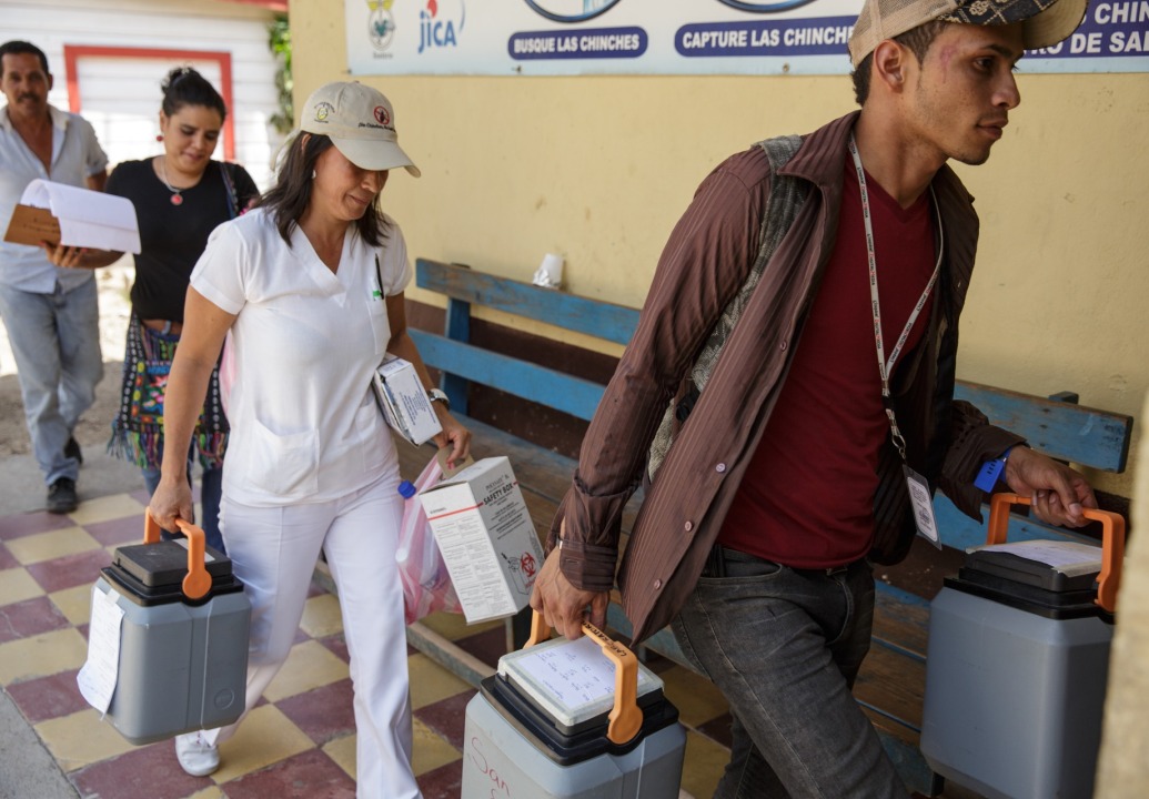 health-workers-transporting-vaccines